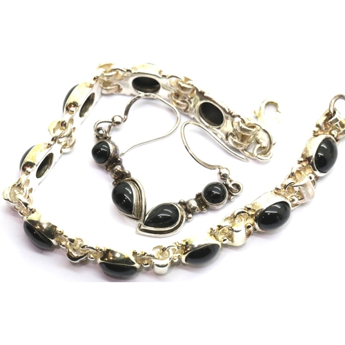 1039 - Boxed Whitby jet and silver bracelet and earringsset. P&P Group 1 (£14+VAT for the first lot and £1+... 