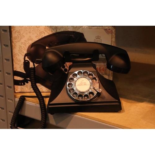 52 - The GPO 200 rotary telephone has a metal base and handset; traditional cloth curly cord;  is compati... 