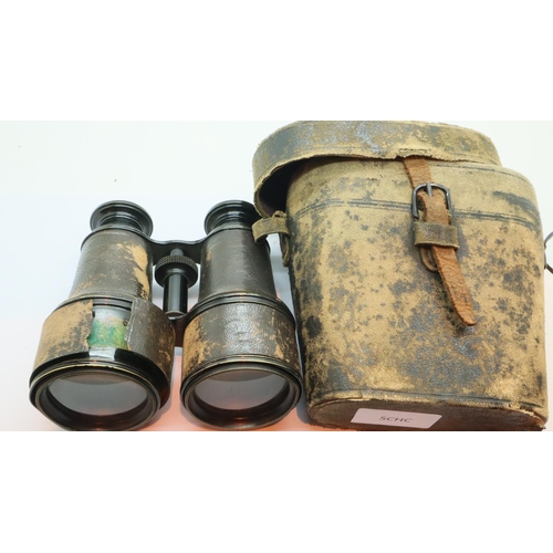 1165 - Pair of leather cased vintage leather covered binoculars. P&P Group 2 (£18+VAT for the first lot and... 
