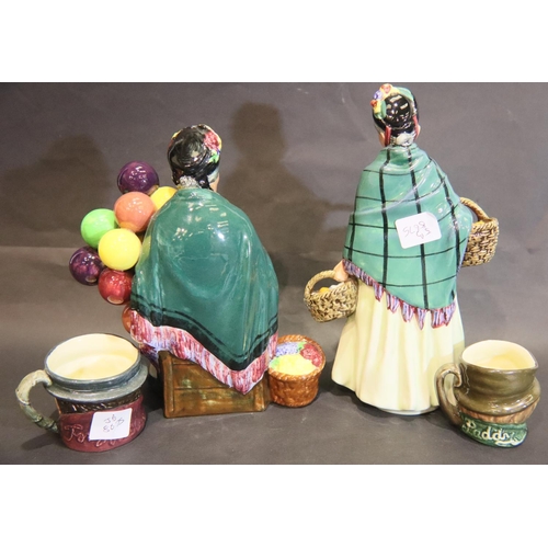 255 - Royal Doulton Orange Lady HN1953, the Old Balloon Seller HN1315 and two small character jugs. P&P Gr... 