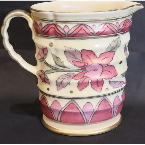 274 - Charlotte Rhead for Crown Ducal, a tube lined ribbed pitcher, H: 18 cm. P&P Group 2 (£18+VAT for the... 