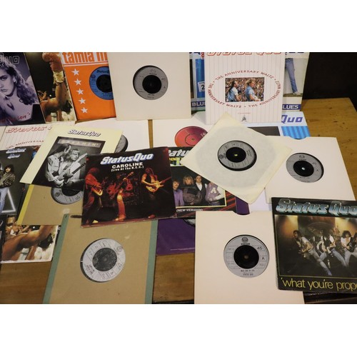 207 - Thirty Status Quo singles. P&P Group 2 (£18+VAT for the first lot and £3+VAT for subsequent lots)