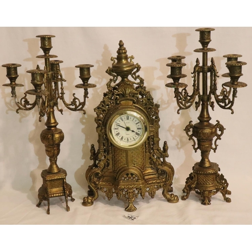 362 - Contemporary brass cased mantel clock with quartz movement with a pair of five sconce garnitures. No... 