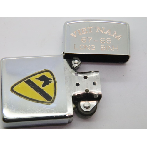 423 - Retro copy Vietnam windproof lighter with 1st Air Cav logo. P&P Group 1 (£14+VAT for the first lot a... 