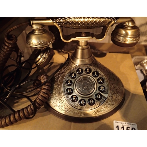 1150 - The Duchess, push button telephone with a solid, brass finish and traditional cloth handset curly co... 