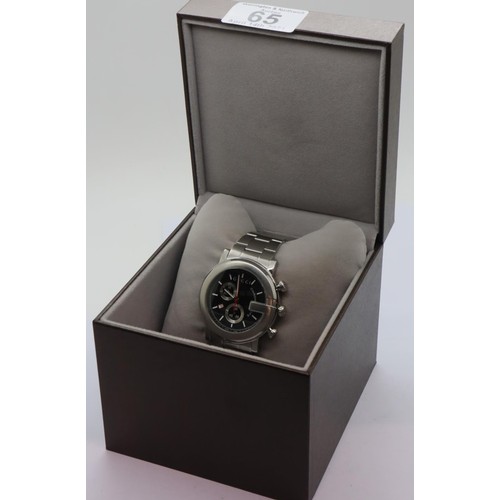 65 - Gents Gucci chronograph wristwatch, having a black dial, stainless steel body and bracelet in origin... 