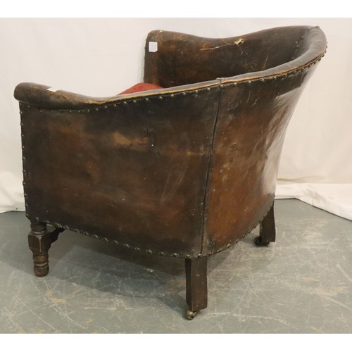 535 - 1920s studded brown leather club chair with upholstered seat and oak twist supports, 68 x 69 x 70 cm... 