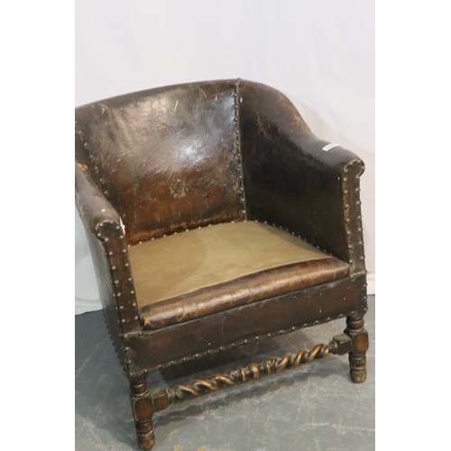 535 - 1920s studded brown leather club chair with upholstered seat and oak twist supports, 68 x 69 x 70 cm... 