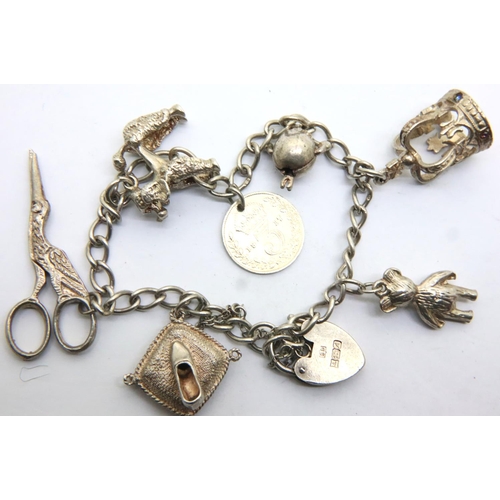 59 - Three silver charm bracelets, combined 98g. P&P Group 1 (£14+VAT for the first lot and £1+VAT for su... 