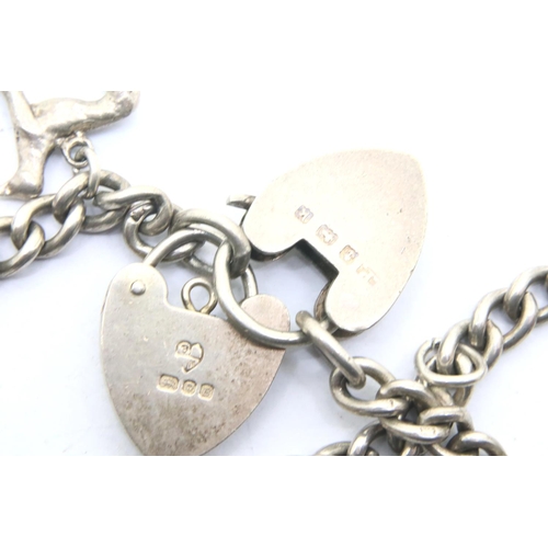 59 - Three silver charm bracelets, combined 98g. P&P Group 1 (£14+VAT for the first lot and £1+VAT for su... 