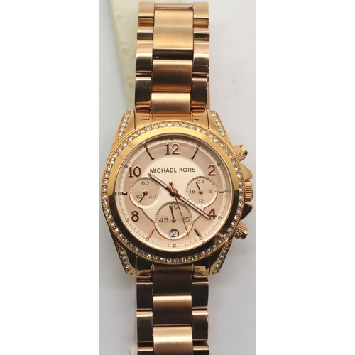 106 - New Michael Kors rose gold coloured ladies wristwatch. P&P Group 1 (£14+VAT for the first lot and £1... 