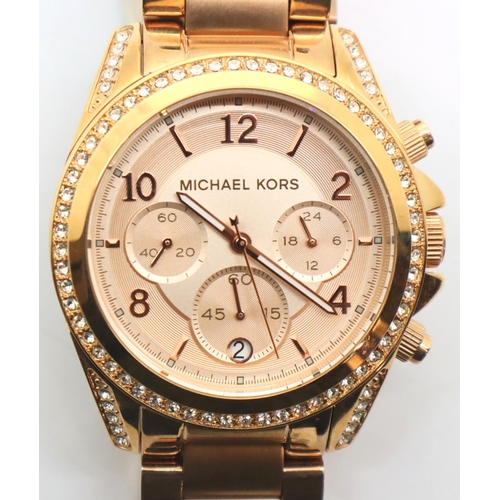 106 - New Michael Kors rose gold coloured ladies wristwatch. P&P Group 1 (£14+VAT for the first lot and £1... 