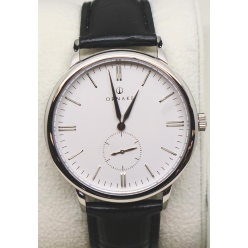 133 - New and boxed white face stainless steel Ornake wristwatch with seconds dial and leather strap. P&P ... 