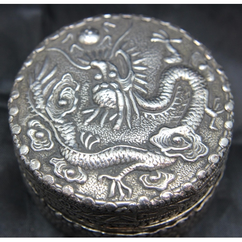 152 - Chinese silver dressing table pot with embossed Dragon chasing pearl to lid. P&P Group 1 (£14+VAT fo... 