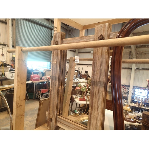 1407 - Heavy framed industrial type faux wood mirror 40 x 60cm. Not available for in-house P&P, contact Pau... 