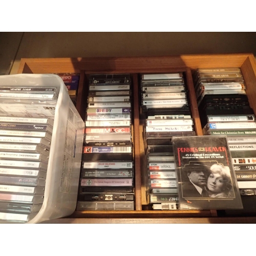 1417 - Drawer of mixed cds and tape cassettes. Stained oak three seater garden bench. Not available for in-... 