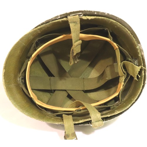 3070 - American WWII olive green helmet with fibre liner and straps, possibly post-war, outer helmet with B... 