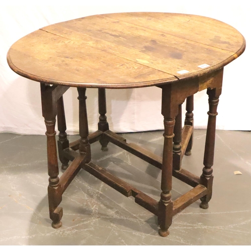 419 - A late 18th Century oak farmhouse dropleaf table of small proportions raised on gate supports, 88 x ... 