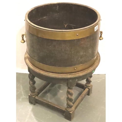 422 - Quarter size brass bound twin handled barrel planter upon an oak barleytwist base. Not available for... 