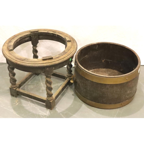 422 - Quarter size brass bound twin handled barrel planter upon an oak barleytwist base. Not available for... 