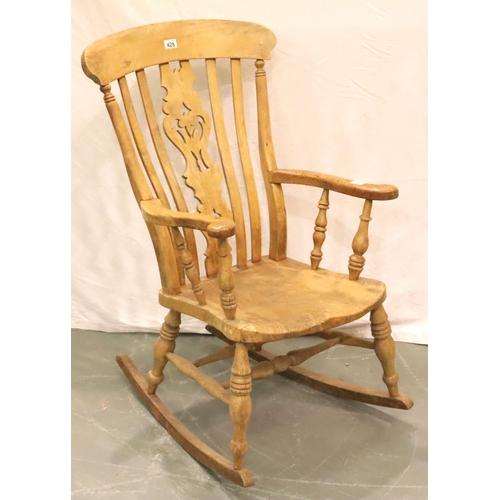 428 - Victorian farmhouse elm rocking chair with pierced backrest and turned elbow supports. Not available... 