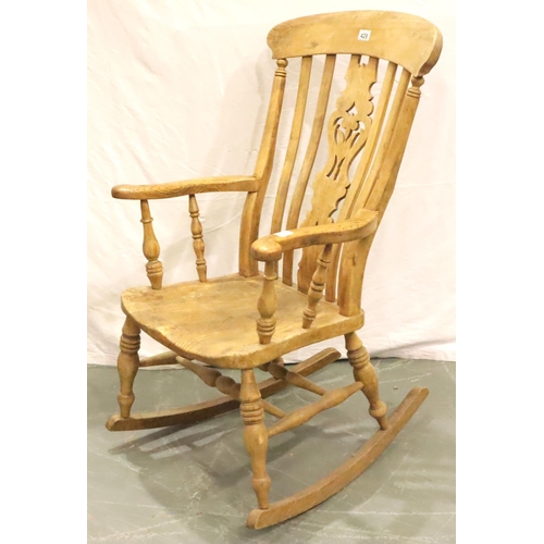 428 - Victorian farmhouse elm rocking chair with pierced backrest and turned elbow supports. Not available... 