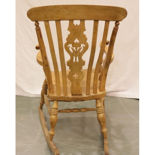 428 - Victorian farmhouse elm rocking chair with pierced backrest and turned elbow supports. Not available... 