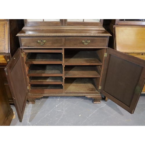 437 - Late Victorian walnut glazed bookcase, raised on a two drawer, two door cupboard base and Ogee carve... 