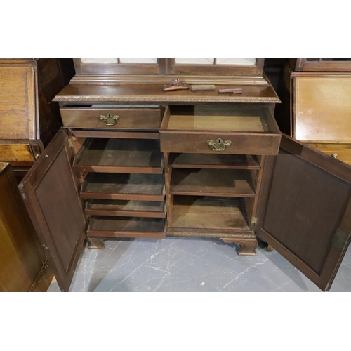 437 - Late Victorian walnut glazed bookcase, raised on a two drawer, two door cupboard base and Ogee carve... 