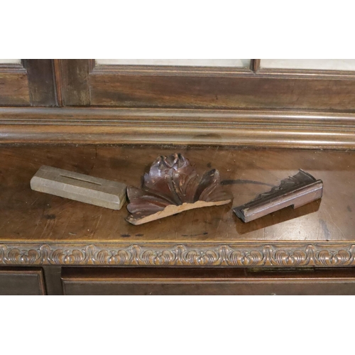 437 - Late Victorian walnut glazed bookcase, raised on a two drawer, two door cupboard base and Ogee carve... 