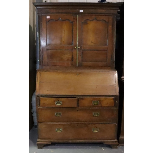 438 - George III Provincial oak bureau bookcase, the two door cupboard above fitted fall front desk and fo... 