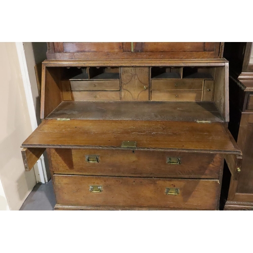 438 - George III Provincial oak bureau bookcase, the two door cupboard above fitted fall front desk and fo... 