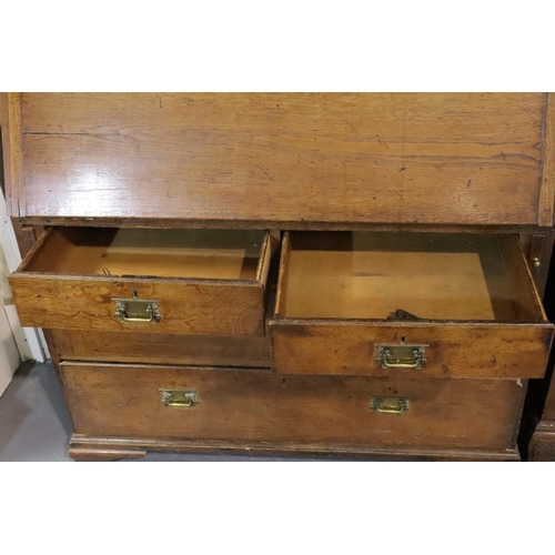 438 - George III Provincial oak bureau bookcase, the two door cupboard above fitted fall front desk and fo... 