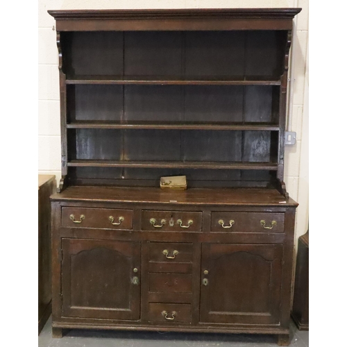 441 - George II oak dresser, the three shelf plate rack raised on a base of cupboards and drawers, 140 x 4... 