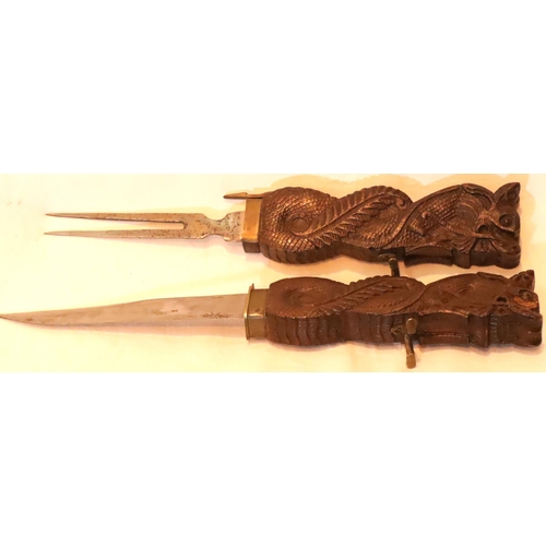 1098 - Unusual carved wood Oriental carving knife and fork set. Not available for in-house P&P, contact Pau... 