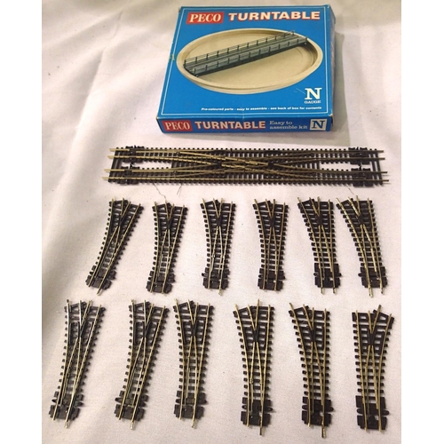 2303 - Twelve N gauge Peco points, scissor crossing and turntable, mostly in used - good condition. P&P Gro... 