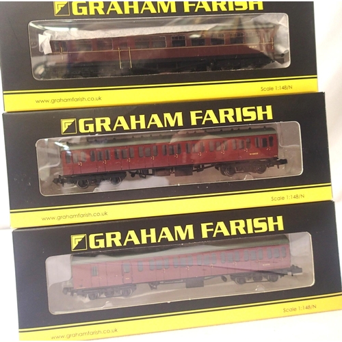 2316 - Three N gauge Farish coaches, 374-311A and 374-290A, both BR suburban red and a 374-611 auto coach B... 