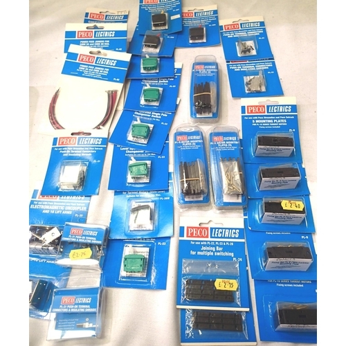 2297 - Selection of Peco electrics including; mounting plates 5x, switches 8x, wire 2x, electromagnetic unc... 