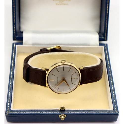 93 - Garrard 9ct gold gents wristwatch with mechanical movement, white dial gold hands and markers, subsi... 