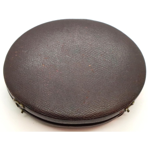 143 - Silhouette of a Victorian/Georgian gentleman in an oval brown leather case. P&P Group 2 (£18+VAT for... 