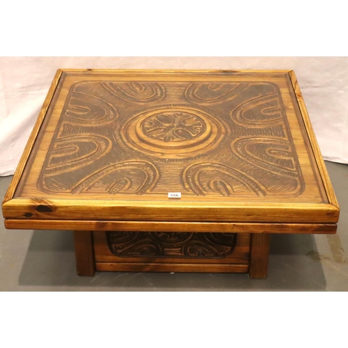 556 - A substantial modern carved pine coffee table with glass top and carved plinth base, 101 x 101 x 93 ... 