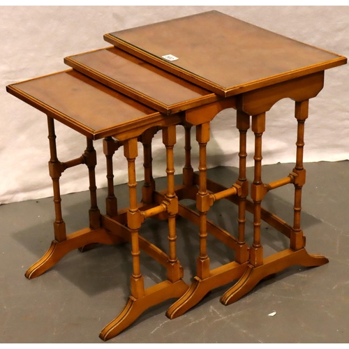 560 - Bevan Funnell for Reprodux a nest of three graduated occasional tables with glass tops, 51 x 36 x 56... 