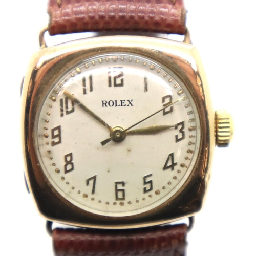 111 - 1950s 9ct gold Rolex wristwatch on leather strap in working order. P&P Group 1 (£14+VAT for the firs... 