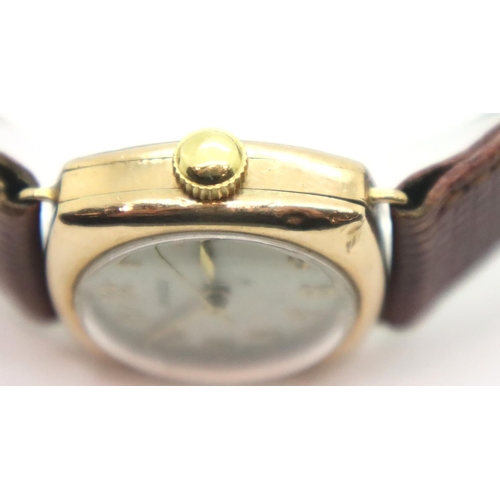 111 - 1950s 9ct gold Rolex wristwatch on leather strap in working order. P&P Group 1 (£14+VAT for the firs... 