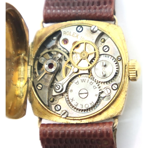 111 - 1950s 9ct gold Rolex wristwatch on leather strap in working order. P&P Group 1 (£14+VAT for the firs... 