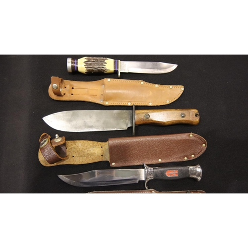 365 - Three hunting knives including a Nowill example. P&P Group 3 (£25+VAT for the first lot and £5+VAT f... 