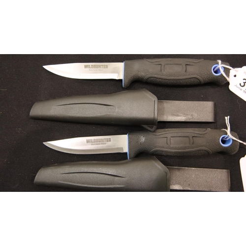 372 - Two plastic sheathed rubber handled Wild Hunter stainless steel knives, blade L: 10 cm. P&P Group 2 ... 