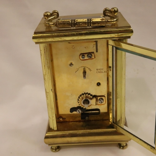 393 - Postilion 20th century lacquered brass carriage clock with five bevelled glass display panels, the d... 