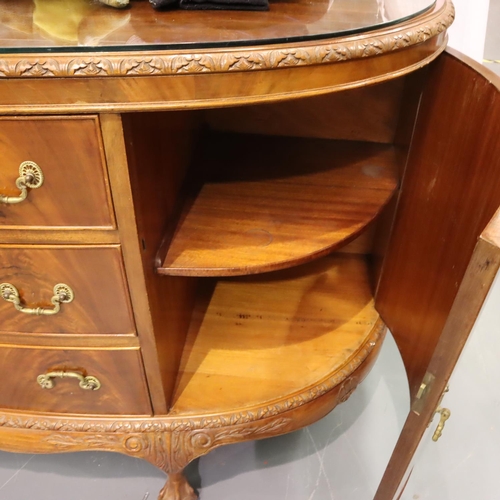 543 - A 20th century walnut three drawer, two door sideboard in the Epstein style, raised on claw and ball... 