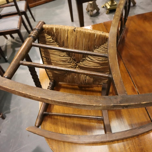 550 - Oak framed cane seated rocking chair. Not available for in-house P&P, contact Paul O'Hea at Mailboxe... 